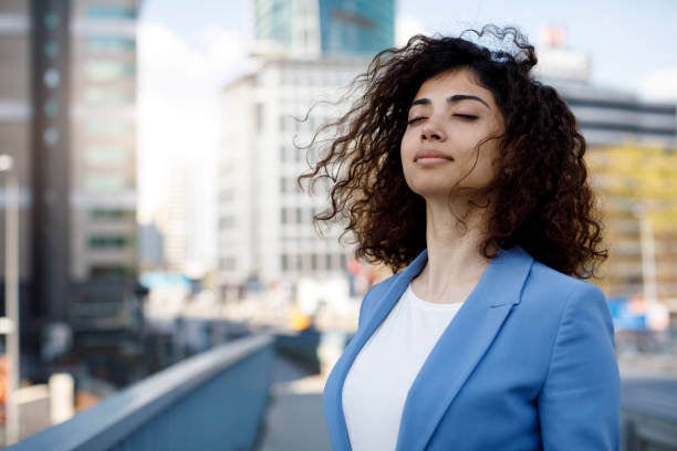 Woman breathing with eyes closed